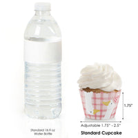 Standard 16.9 oz water bottle next to a cupcake with a pink wrapper, showing size comparison.