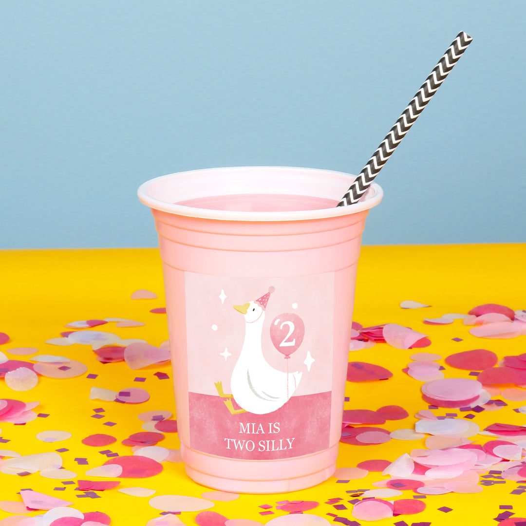 Close-up of goose design personalized sticker on pink party cup