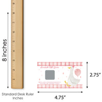 Stork scratch-off game with dimensions shown on a standard desk ruler.