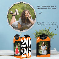 Orange graduation table decor with photo holder centerpieces