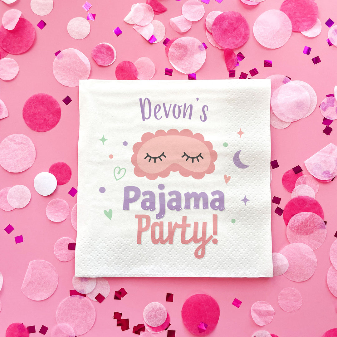 Party napkin with 'Devon's Pajama Party!' text on a pink background with confetti