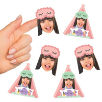 A collection of custom face cut-out stickers with a photo of a girl in a sleep mask, designed in two different shapes, being held between fingers.