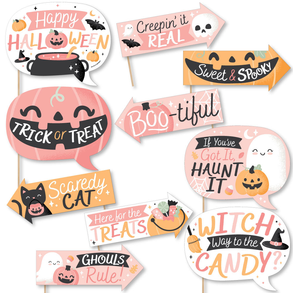 A set of colorful Halloween-themed photo booth props with various text and imagery related to the Halloween holiday.