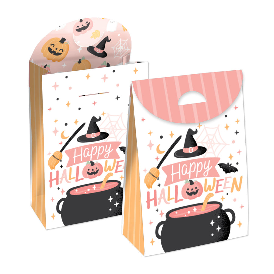 Two Halloween-themed gift favor bags with pink and pastel colors, featuring pumpkins, a witch's hat, and the text 'Happy Halloween'. The bags are designed to be assembled by the user.