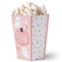 A pink popcorn treat box with a pumpkin and ghosts pattern, filled with popcorn.
