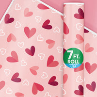 Roll of wrapping paper with a pattern of pink and red hearts, indicating it is designed for Valentine's Day gift wrapping. The paper is marked as 7 ft.