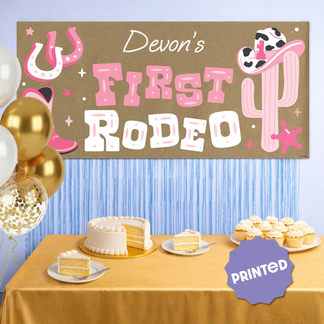 Pink western first birthday party backdrop with banner