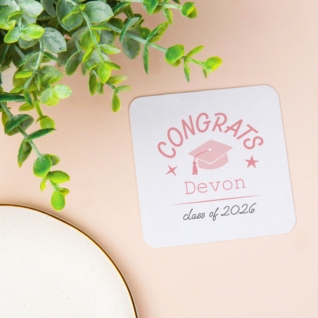 Pink custom name and year coaster close-up