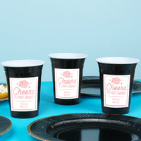 Pink personalized graduation cups on drink station