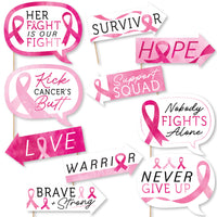 Collection of pink ribbon-themed signs with motivational phrases on a white background