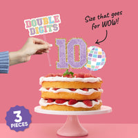 Cake topper displayed on decorated birthday cake