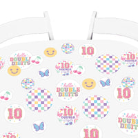 Confetti scattered on girls birthday table setup