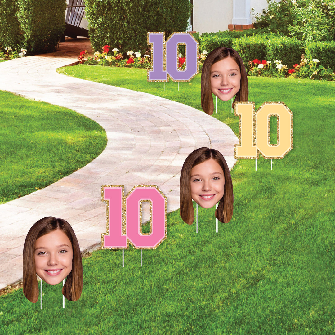 Yard signs displayed along walkway for birthday party