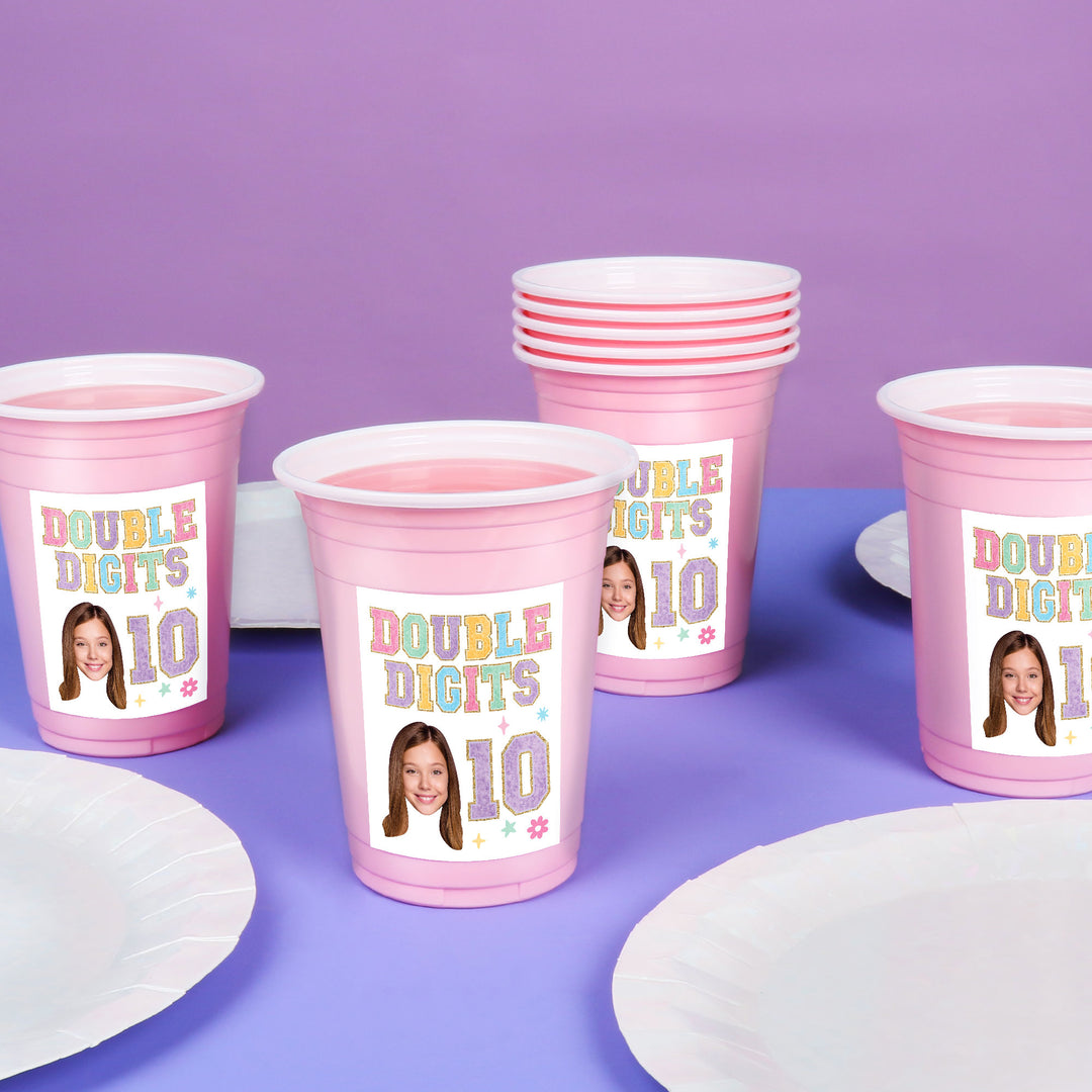 Party cups styled on girls birthday drink table