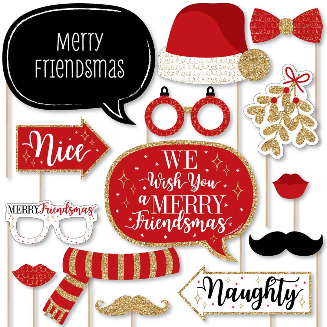 A collection of red and gold Christmas-themed photo booth props, including signs, hats, glasses, and mustaches.