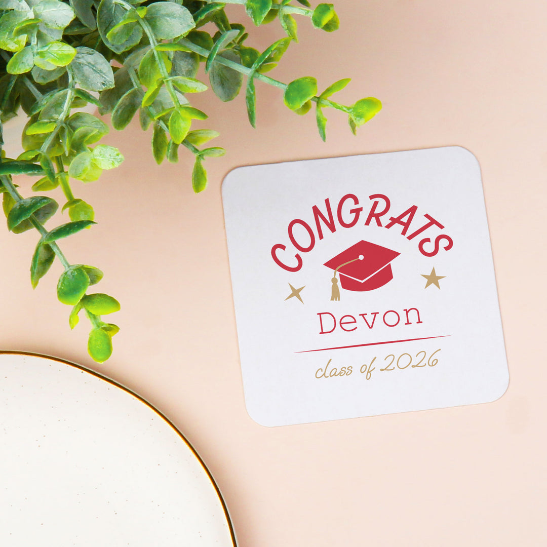 Red custom text graduation coaster close-up
