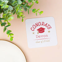 Red custom text graduation coaster close-up
