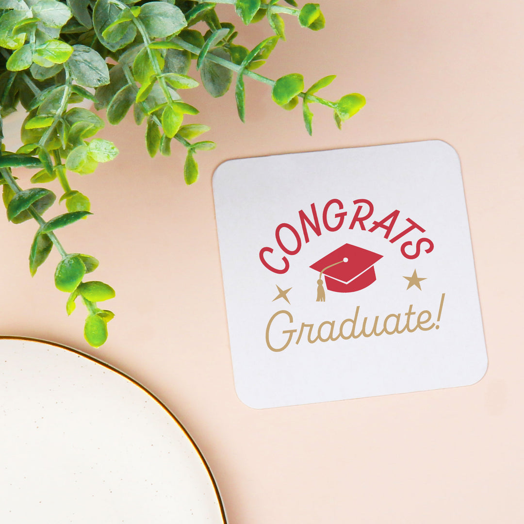 Red graduation cap coaster close-up