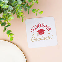 Red graduation cap coaster close-up