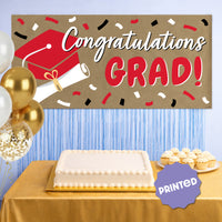Red graduation banner used as graduation party backdrop