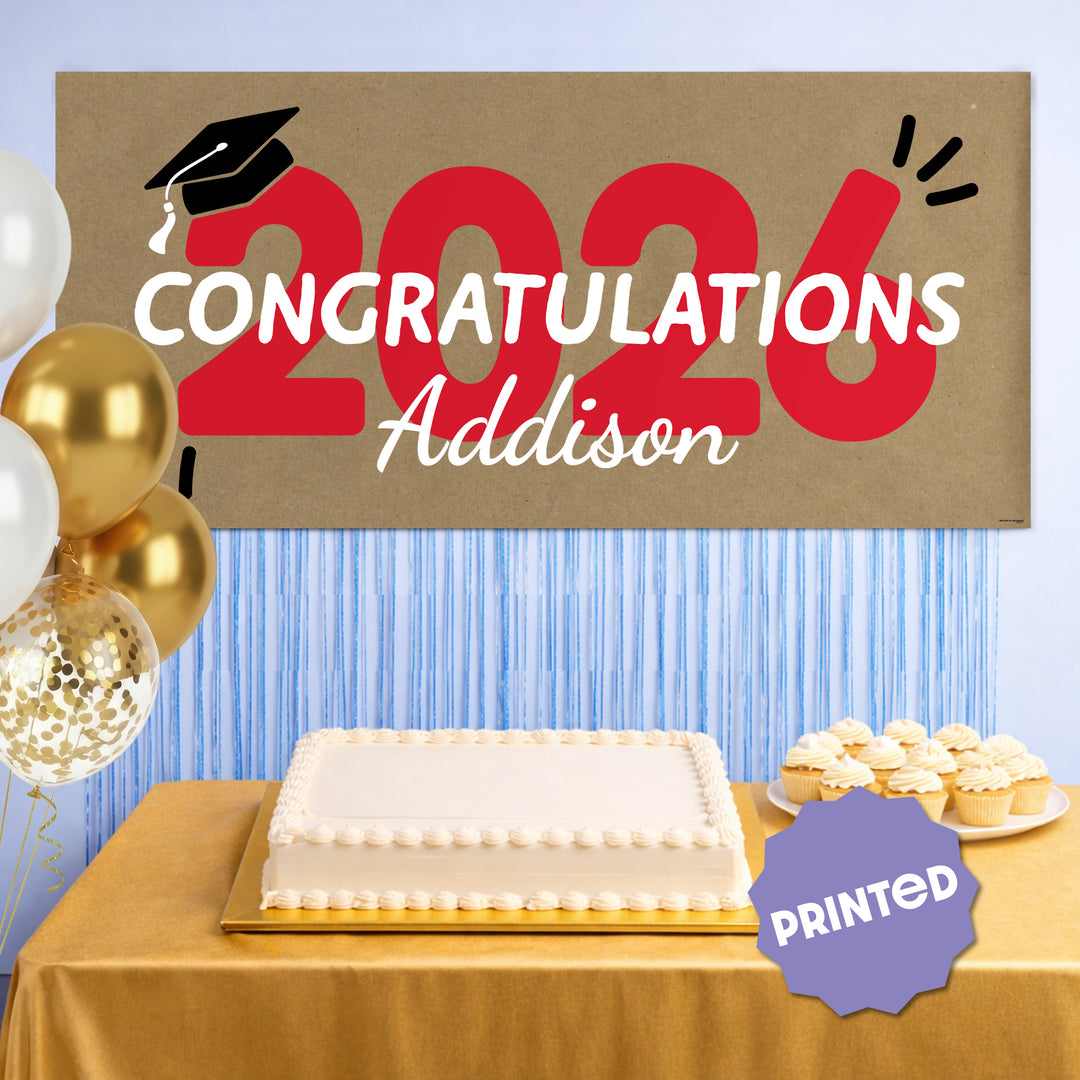 Red 2026 graduation banner hanging as party backdrop