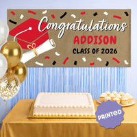 Red graduation banner hanging at graduation party