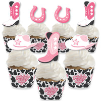 Cupcake decoration kit with pink cowgirl-themed wrappers and treat picks featuring boots, hats, and stars.