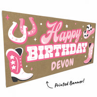 Cowgirl boots and horseshoe artwork close-up