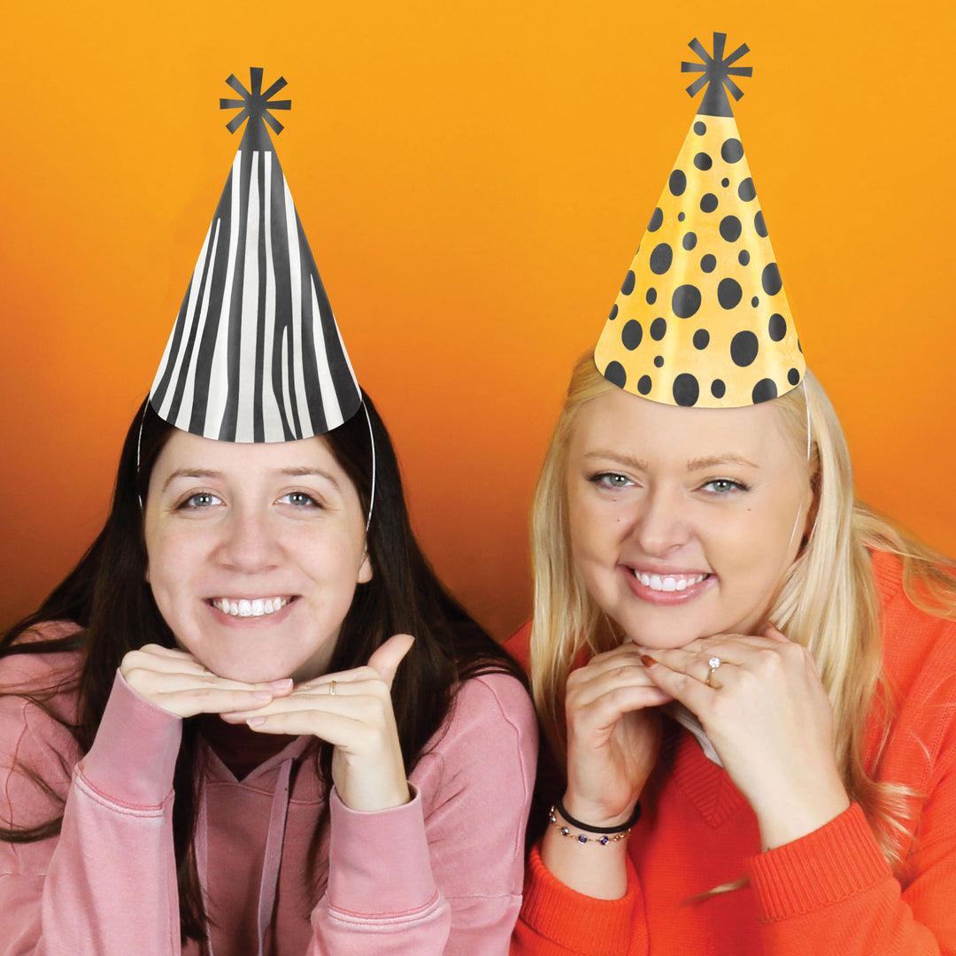 Animal print cone hats styled for jungle birthday celebration