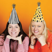 Animal print cone hats styled for jungle birthday celebration