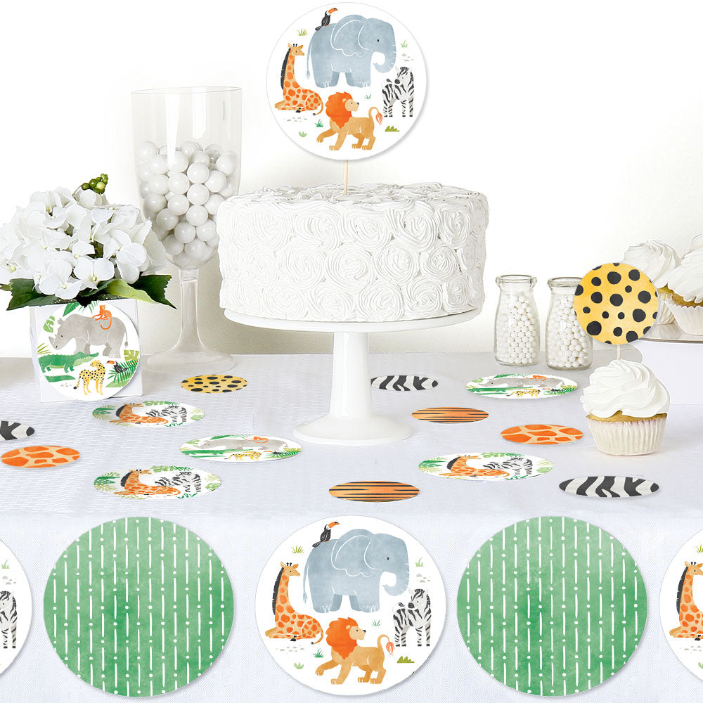 Safari animals table confetti styled for jungle birthday party decor