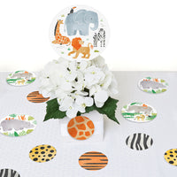 Safari animals table confetti styled for jungle birthday party decor
