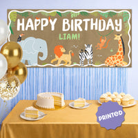 Jungle safari birthday banner styled at wild one party