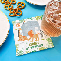 Safari birthday party table with personalized napkins