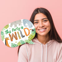 Safari birthday party photo booth with jungle props