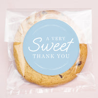 Cookie with a 'A Very Sweet Thank You' label on a pink background