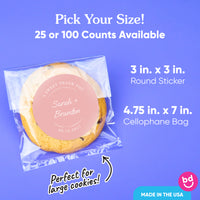 Packaged cookie with a round sticker on a blue background, showing size options and branding.