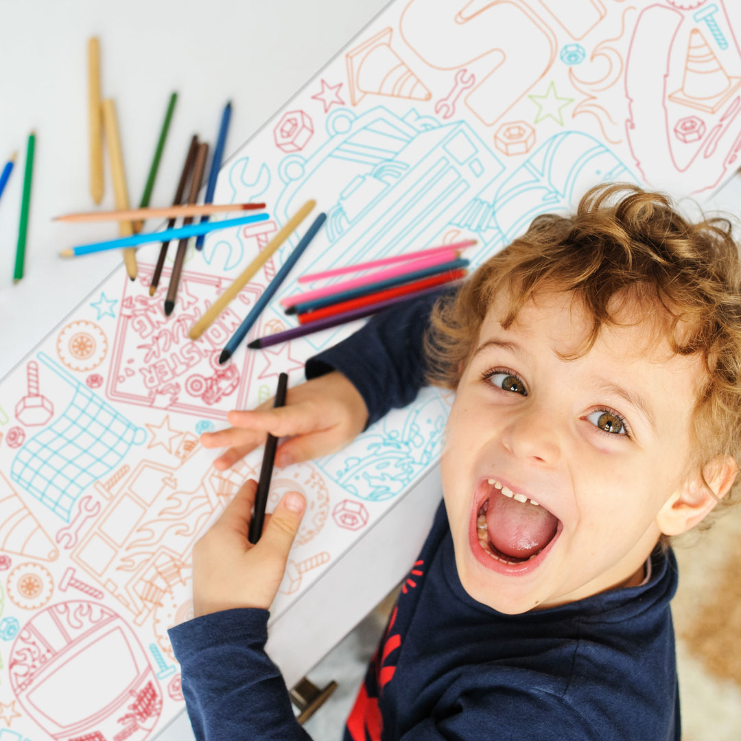 Kids coloring monster truck table runner at birthday party
