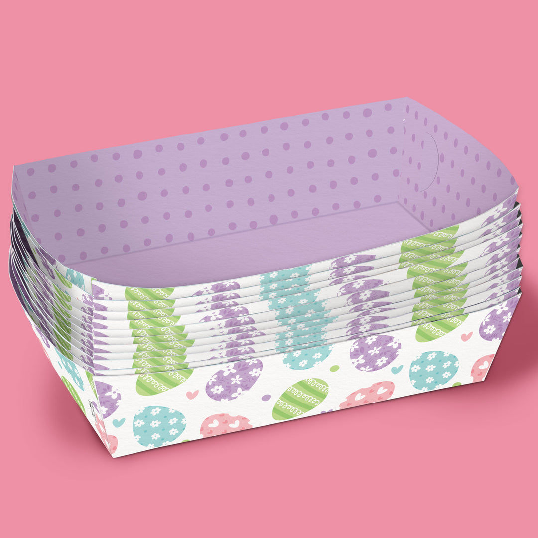Stack of paper trays with Easter designs on a pink background