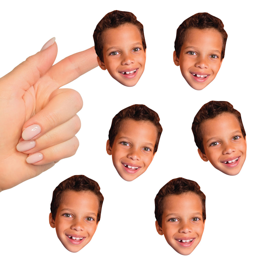 A set of custom face cut-out stickers with a photo of a smiling child. The stickers are designed to be applied onto various surfaces for decoration.