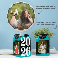 Teal graduation party table styled with photo holders