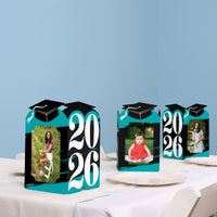 Teal graduation party table styled with photo holders