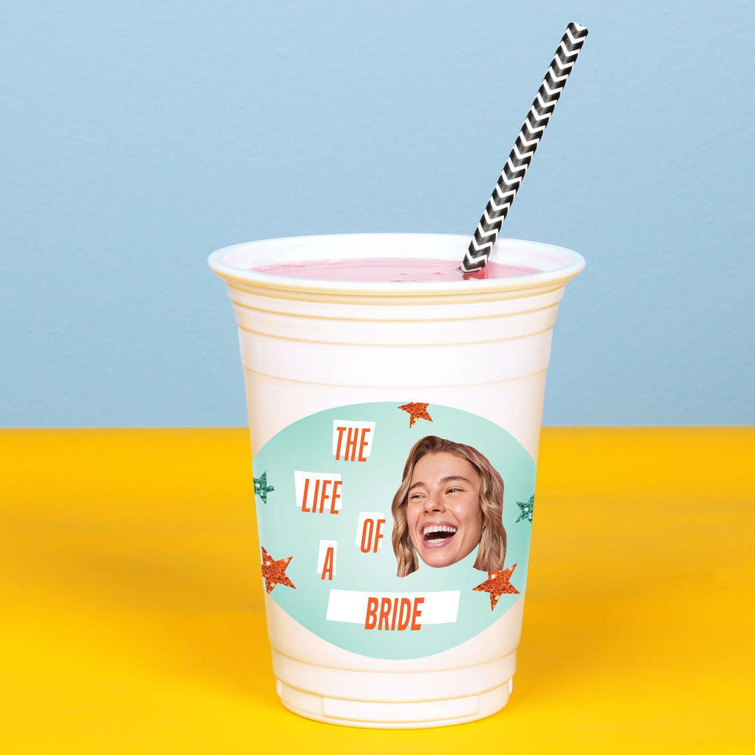 White 16 oz plastic cup with curved custom sticker