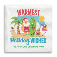 Napkin with Santa Claus and tropical elements, featuring 'Warmest Holiday Wishes'.
