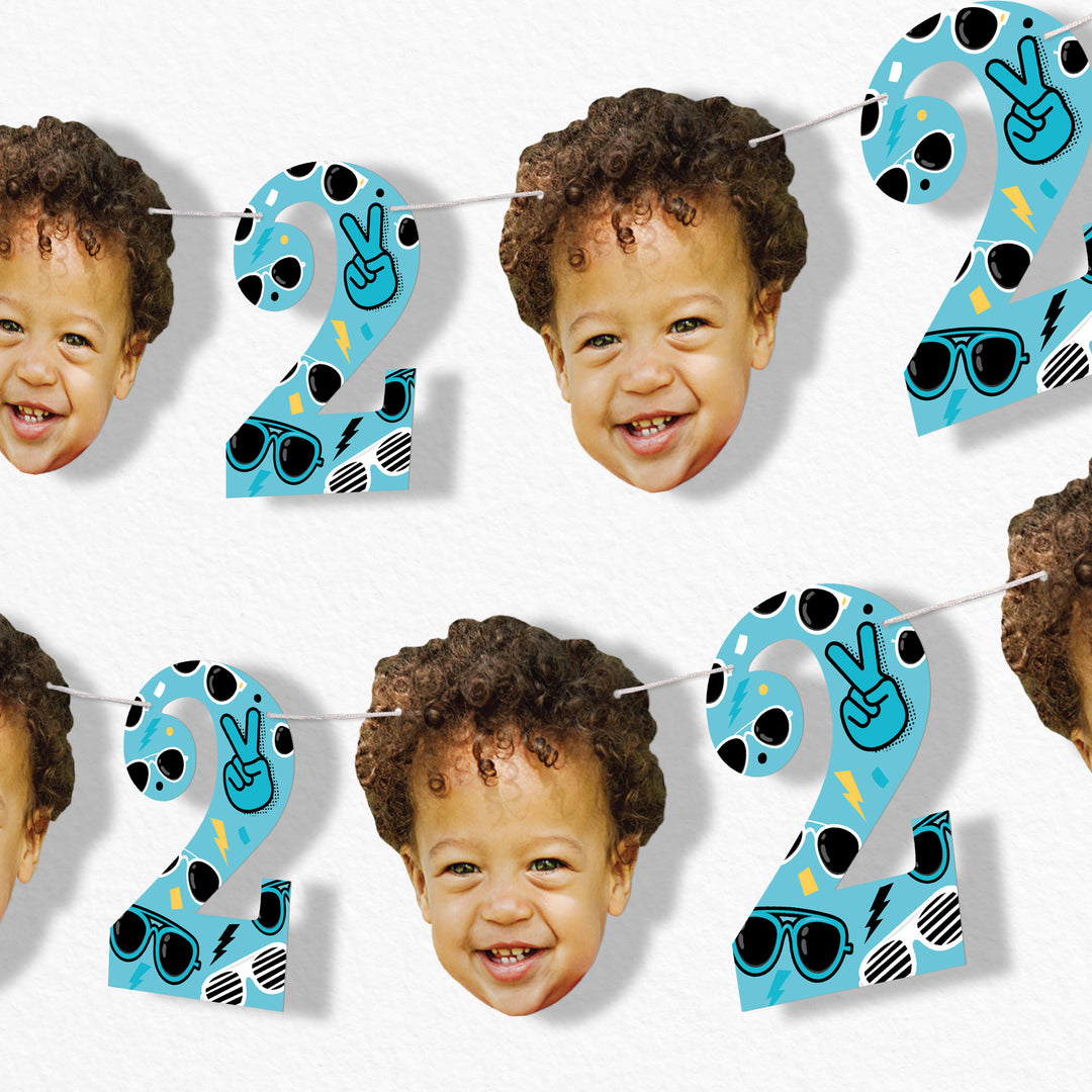 Children's custom birthday banner with number '2' and faces on a white background