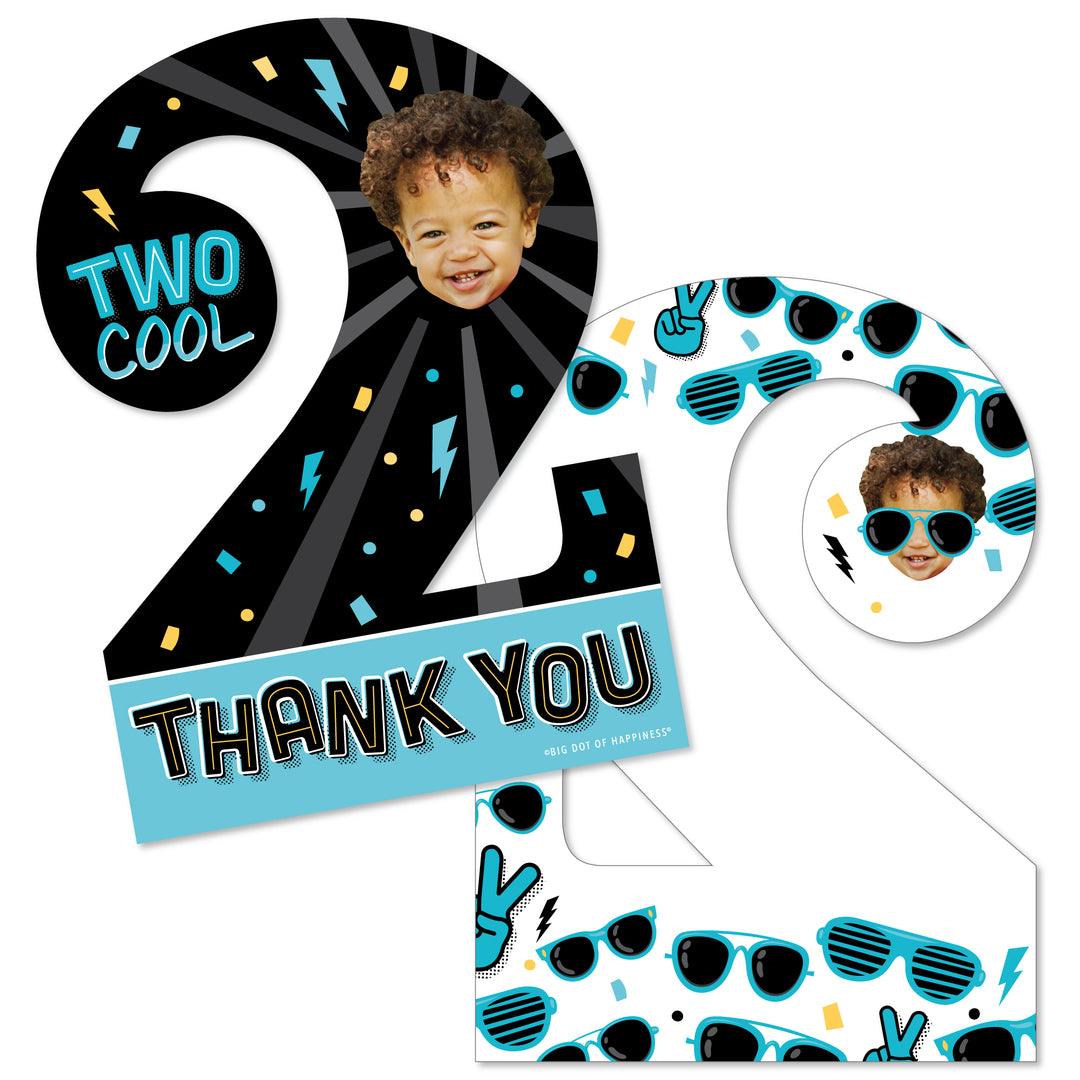 A set of personalized thank you cards for a boy's second birthday party with a 'Two Cool' theme, featuring sunglasses graphics and a space for a photo upload. The cards are in the shape of the number 2 and come with white envelopes.