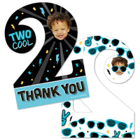 A set of personalized thank you cards for a boy's second birthday party with a 'Two Cool' theme, featuring sunglasses graphics and a space for a photo upload. The cards are in the shape of the number 2 and come with white envelopes.
