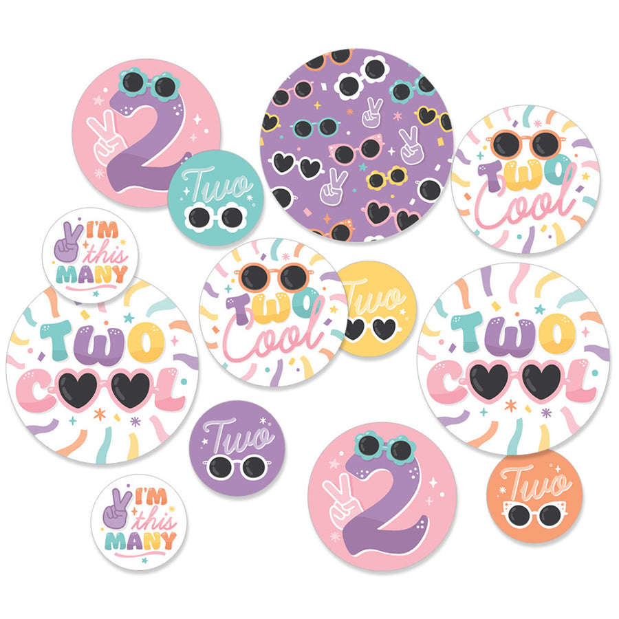 A collection of multicolored round confetti pieces with 'Two Cool' text and various patterns.