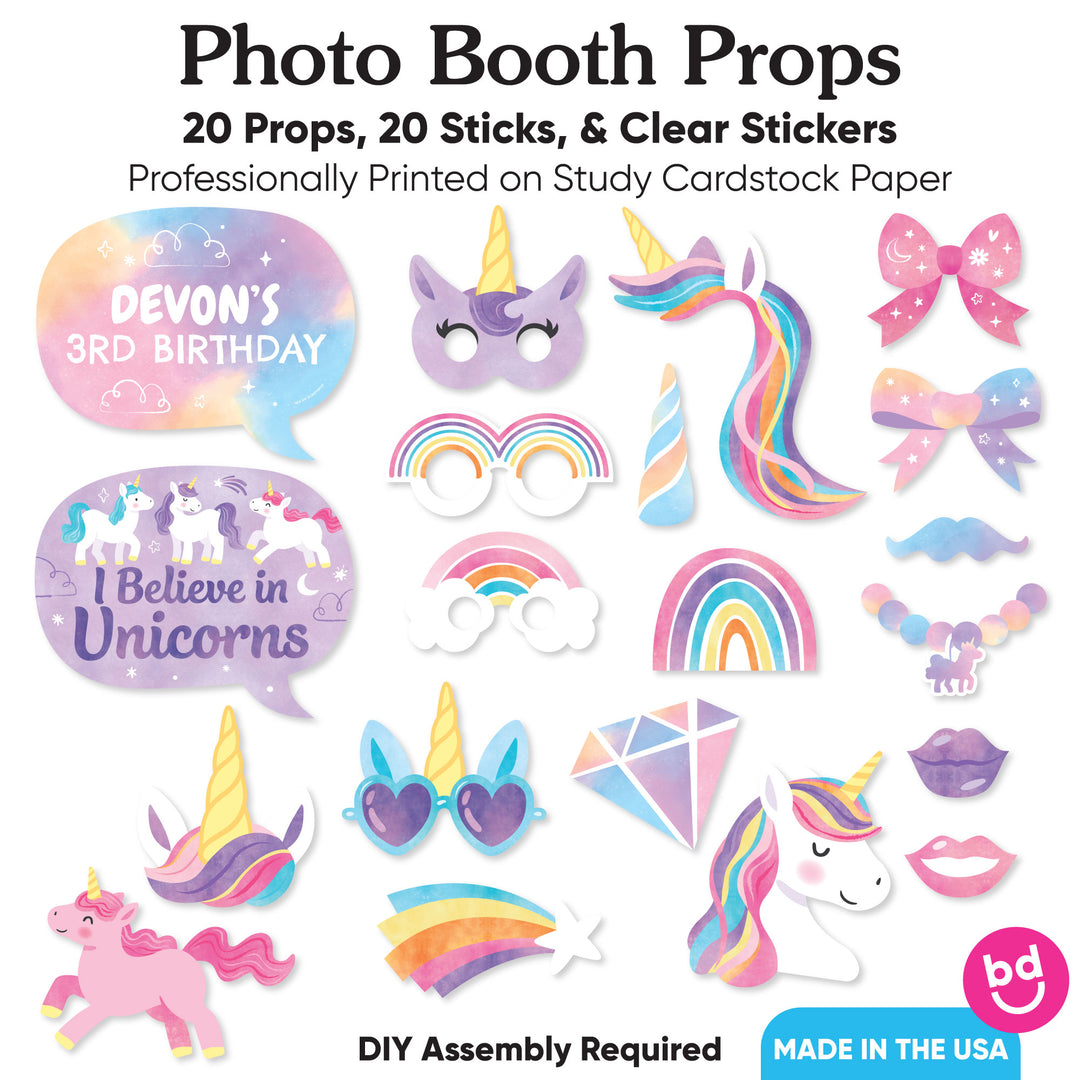 Collection of photo booth props with unicorn and rainbow designs on a white background.
