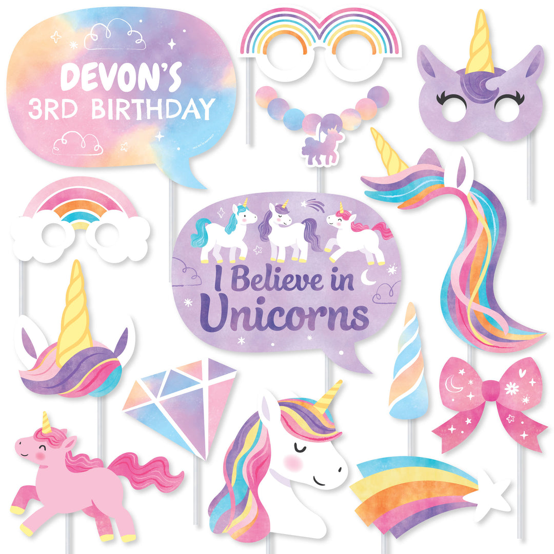 Unicorn-themed birthday party decorations with 'I Believe in Unicorns' sign and pink unicorn figure.